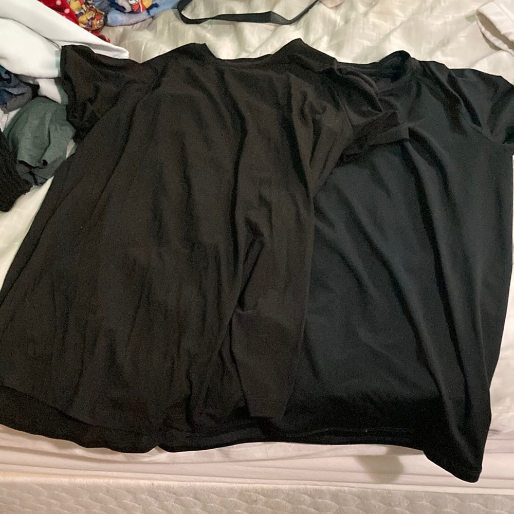 Two plain black shirts